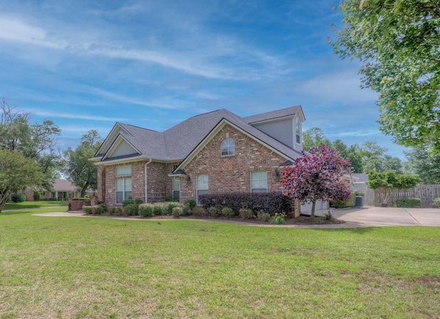 2116 Landau Ln, Bossier City, LA 71111 - traditional home featuring brick siding, driveway, and roof with shingles