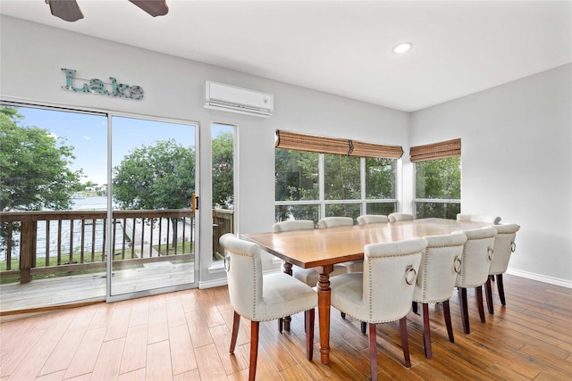 270 Hawk Ln, Brownwood, TX 76801 - dining space featuring a wall mounted AC, wood finished floors, and recessed lighting