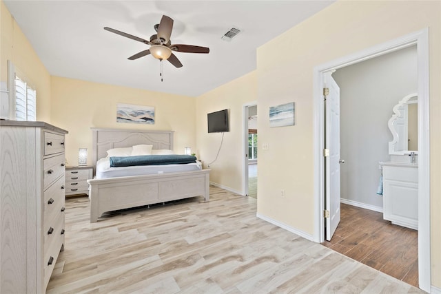 270 Hawk Ln, Brownwood, TX 76801 - bedroom featuring light wood-style floors, ceiling fan, and baseboards