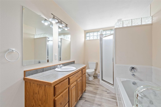 270 Hawk Ln, Brownwood, TX 76801 - bathroom with vanity, a garden tub, a shower stall, and toilet