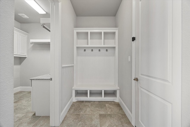 403 Conifer Ln, Allen, TX 75013 - mudroom with baseboards and light stone finish floors