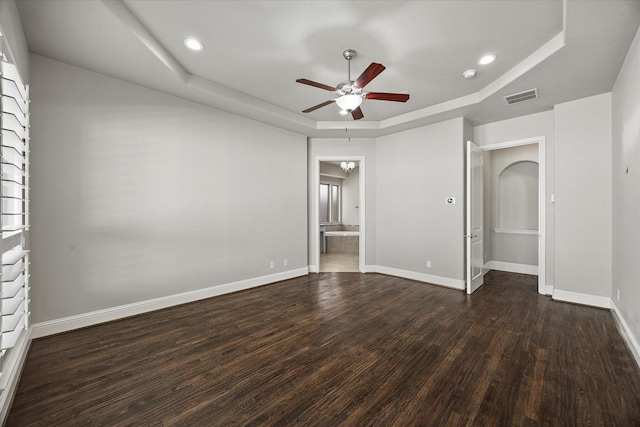 403 Conifer Ln, Allen, TX 75013 - unfurnished bedroom with a raised ceiling, wood finished floors, baseboards, recessed lighting, and connected bathroom