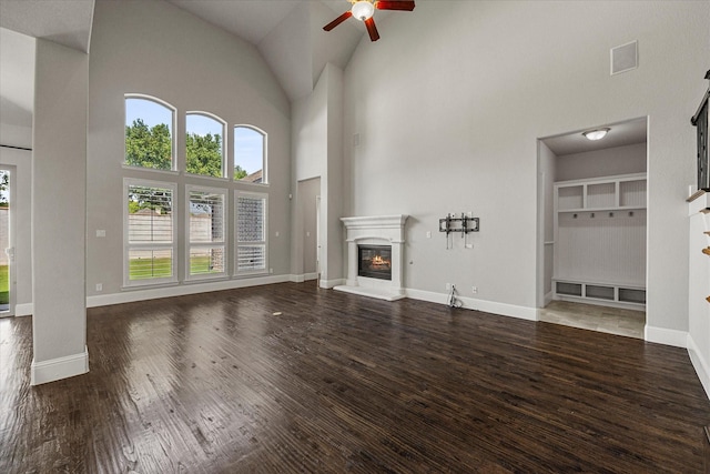 403 Conifer Ln, Allen, TX 75013 - unfurnished living room with a ceiling fan, high vaulted ceiling, wood finished floors, a glass covered fireplace, and baseboards