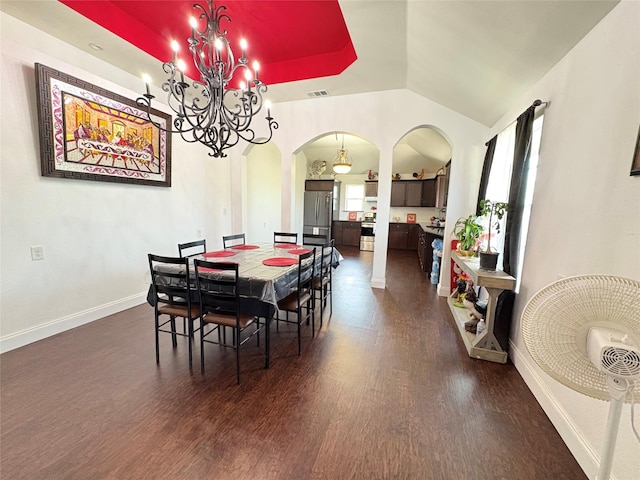 18270 County Road 4160, Frost, TX 76641 - dining space with arched walkways, dark wood-style floors, a chandelier, baseboards, and lofted ceiling