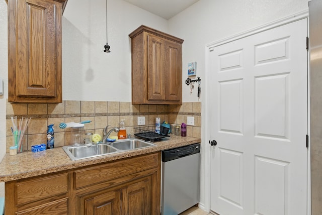 1142 Story Book Ln, Weatherford, TX 76086 - kitchen with dishwasher, a sink, brown cabinetry, and tasteful backsplash