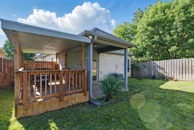 1142 Story Book Ln, Weatherford, TX 76086 - view of home's exterior with brick siding, a wooden deck, and roof with shingles