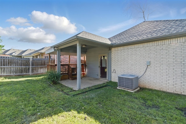 1142 Story Book Ln, Weatherford, TX 76086 - rear view of property featuring brick siding, central AC unit, and a patio