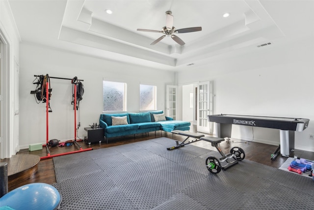 1104 Windsor Dr, Mckinney, TX 75072 - exercise area with wood finished floors, a tray ceiling, a ceiling fan, baseboards, and recessed lighting
