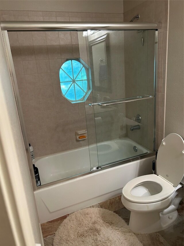 5900 Sandhill Cir, The Colony, TX 75056 - full bathroom with combined bath / shower with glass door and toilet
