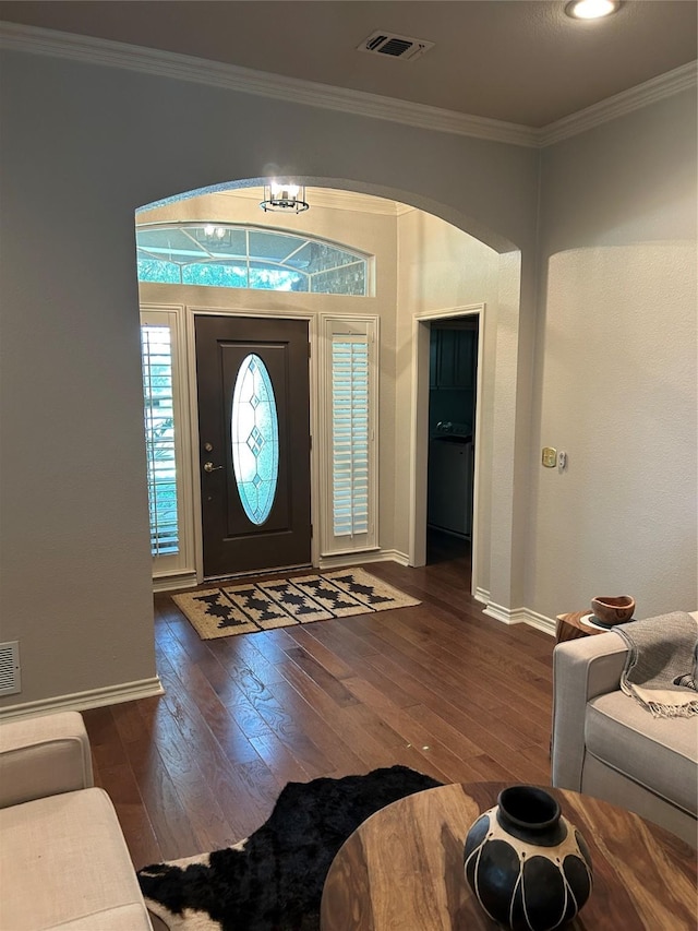 5900 Sandhill Cir, The Colony, TX 75056 - foyer with hardwood / wood-style floors, crown molding, baseboards, and arched walkways