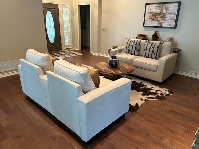 5900 Sandhill Cir, The Colony, TX 75056 - living area featuring dark wood-type flooring and baseboards