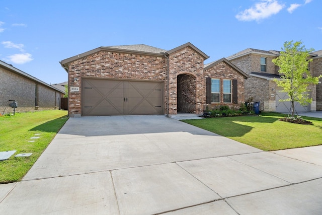 3934 Faulkner Ave, Celina, TX 76227 - view of front facade with concrete driveway, brick siding, a front yard, and an attached garage
