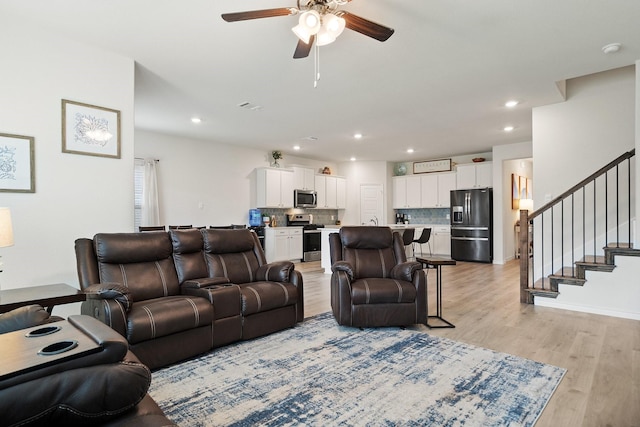 3934 Faulkner Ave, Celina, TX 76227 - living room with ceiling fan, light wood-style flooring, recessed lighting, and stairway