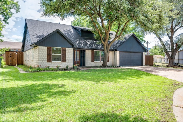 2810 Sunny Hill Ln, Farmers Branch, TX 75234 - view of front of house with roof with shingles, brick siding, driveway, a garage, and a gate