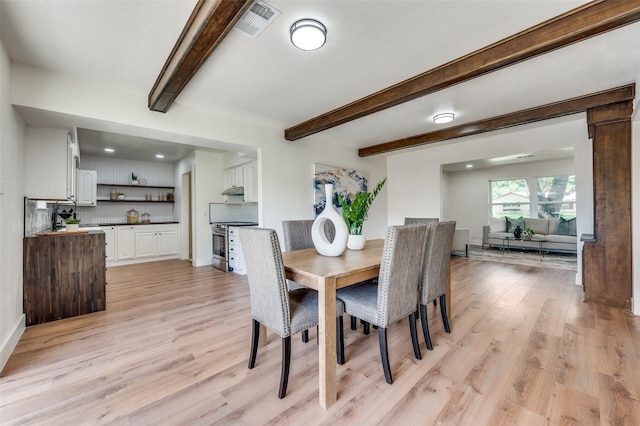 2810 Sunny Hill Ln, Farmers Branch, TX 75234 - dining area with light wood finished floors, beamed ceiling, and recessed lighting