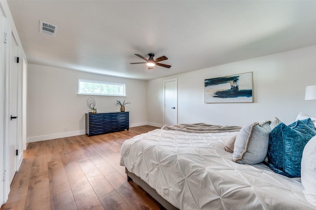 2810 Sunny Hill Ln, Farmers Branch, TX 75234 - bedroom with wood-type flooring and ceiling fan