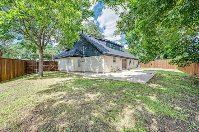 2810 Sunny Hill Ln, Farmers Branch, TX 75234 - rear view of house with a patio, brick siding, and a fenced backyard