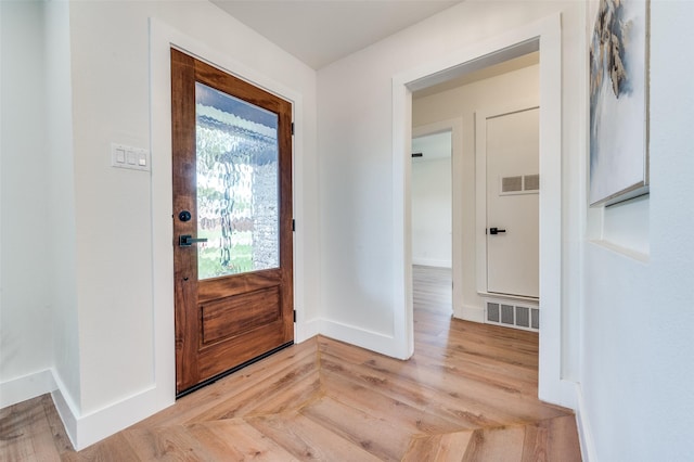 2810 Sunny Hill Ln, Farmers Branch, TX 75234 - foyer entrance featuring baseboards and light wood finished floors