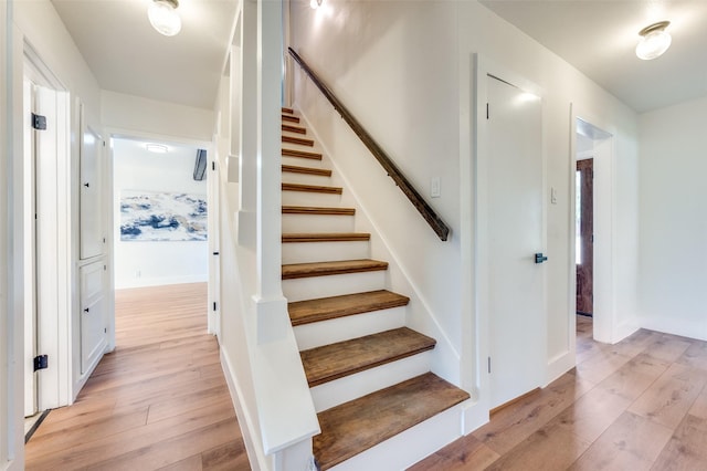 2810 Sunny Hill Ln, Farmers Branch, TX 75234 - stairs featuring wood-type flooring and baseboards