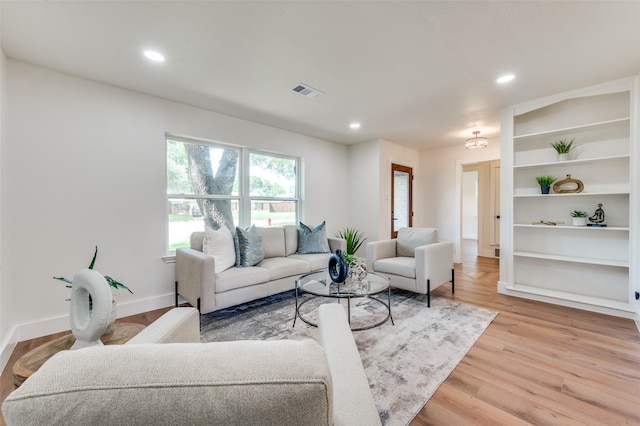 2810 Sunny Hill Ln, Farmers Branch, TX 75234 - living room featuring recessed lighting and light wood-style floors