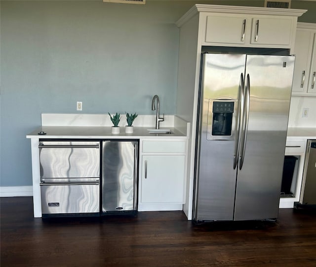 6211 W NW Unit 701, Dallas, TX 75225 - kitchen featuring stainless steel fridge, a sink, and dark wood-style floors
