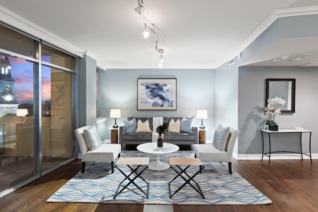 6211 W NW Unit 701, Dallas, TX 75225 - living area featuring wood finished floors, baseboards, and ornamental molding