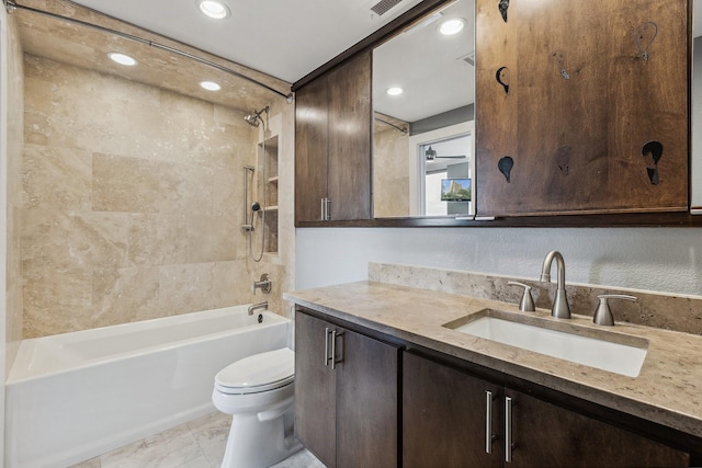6211 W NW Unit 701, Dallas, TX 75225 - bathroom featuring toilet, bathtub / shower combination, vanity, and recessed lighting