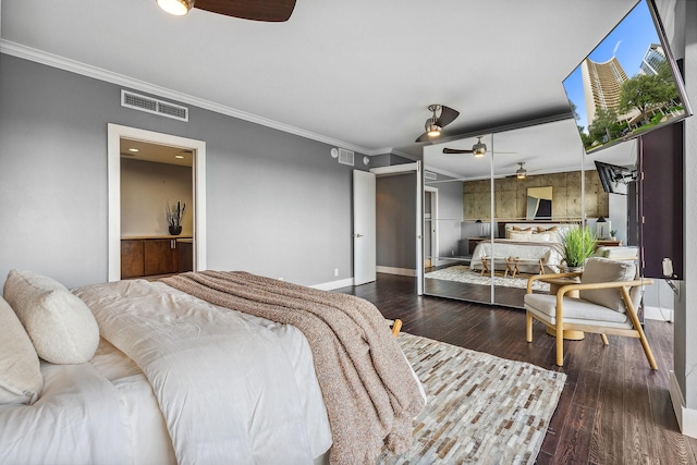 6211 W NW Unit 701, Dallas, TX 75225 - bedroom with crown molding, baseboards, and wood finished floors