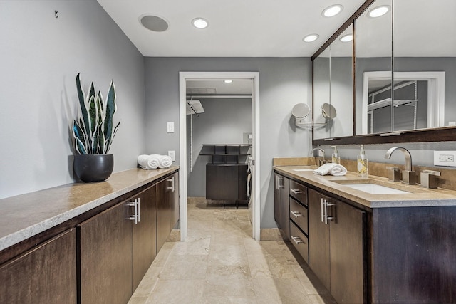 6211 W NW Unit 701, Dallas, TX 75225 - bathroom with recessed lighting, double vanity, and baseboards