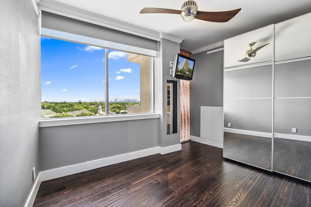 6211 W NW Unit 701, Dallas, TX 75225 - unfurnished bedroom with baseboards, crown molding, wood finished floors, and ceiling fan
