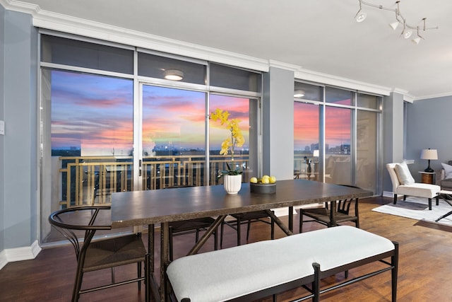 6211 W NW Unit 701, Dallas, TX 75225 - dining space featuring wood finished floors, ornamental molding, and baseboards