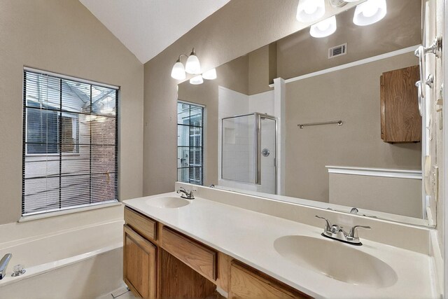 208 Lydia Cir, Irving, TX 75060 - bathroom with a shower stall, lofted ceiling, a garden tub, and double vanity
