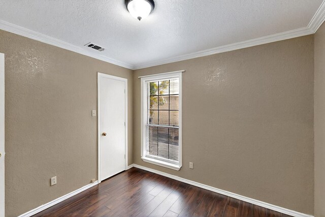 208 Lydia Cir, Irving, TX 75060 - empty room with dark wood-type flooring, crown molding, a textured ceiling, baseboards, and a textured wall