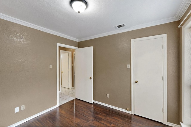 208 Lydia Cir, Irving, TX 75060 - unfurnished bedroom featuring wood finished floors, ornamental molding, and baseboards