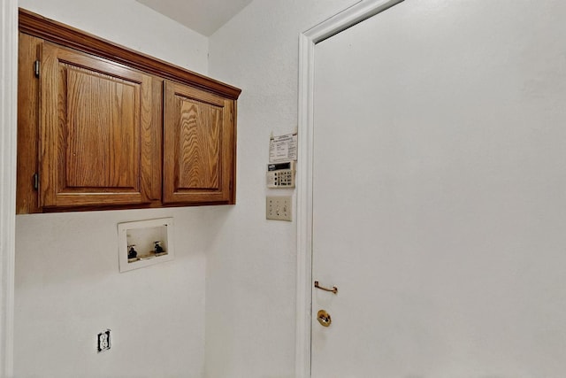 208 Lydia Cir, Irving, TX 75060 - clothes washing area featuring cabinet space and hookup for a washing machine