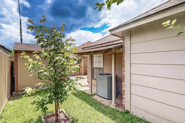 208 Lydia Cir, Irving, TX 75060 - view of yard with central air condition unit, an outdoor structure, and a shed