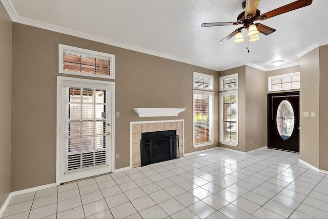 208 Lydia Cir, Irving, TX 75060 - tiled entrance foyer featuring ornamental molding, ceiling fan, a tiled fireplace, and baseboards