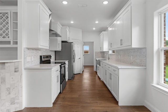 kitchen with stainless steel range with electric cooktop, plenty of natural light, white cabinetry, and recessed lighting