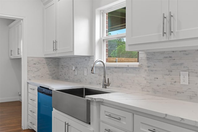kitchen with dishwashing machine, baseboards, dark wood-style floors, and white cabinets