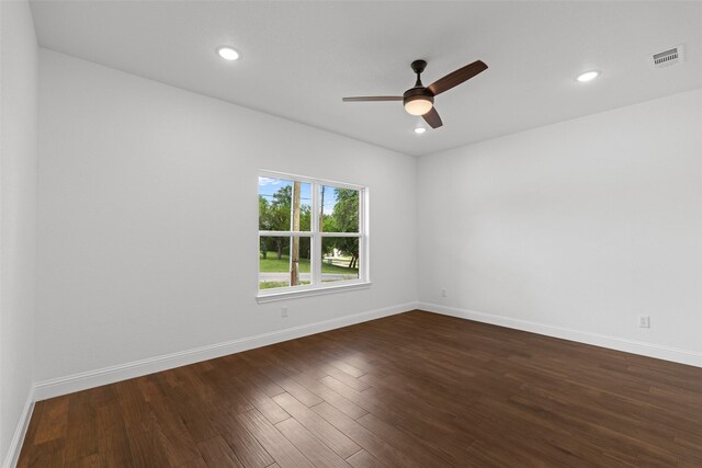 spare room featuring ceiling fan, baseboards, dark wood-style flooring, and recessed lighting