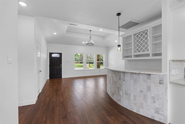 kitchen featuring open shelves, a tray ceiling, dark wood-style flooring, baseboards, and recessed lighting
