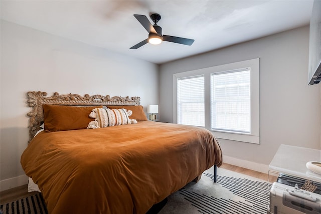 922 S Waverly Dr, Dallas, TX 75208 - bedroom featuring baseboards, wood finished floors, and a ceiling fan