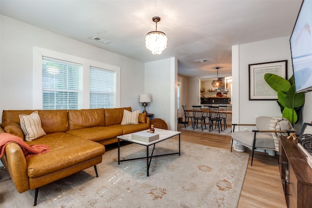 922 S Waverly Dr, Dallas, TX 75208 - living area with light wood finished floors and a chandelier