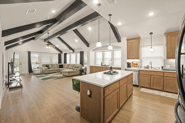 512 Navo Rd, Little Elm, TX 75068 - kitchen featuring stainless steel dishwasher, light countertops, a ceiling fan, a center island, and a sink