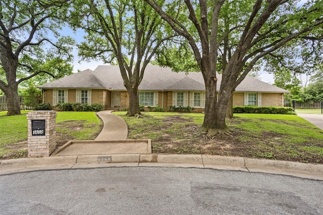 single story home featuring brick siding