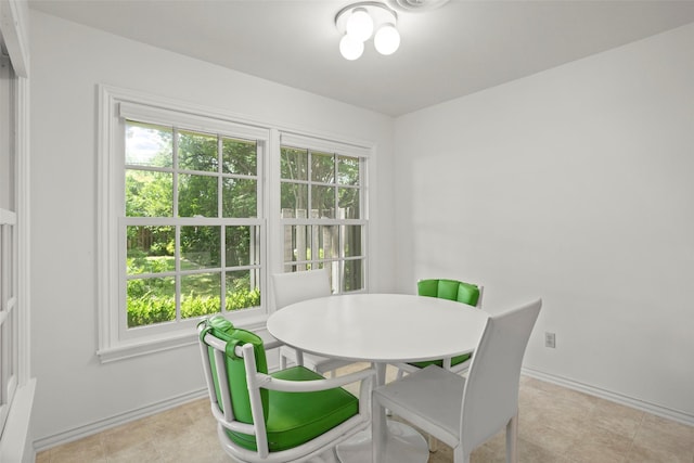 dining area featuring baseboards