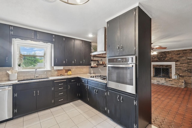 4816 Reynolds Rd, North Richland Hills, TX 76180 - kitchen with stainless steel appliances, a sink, island range hood, a ceiling fan, and a brick fireplace