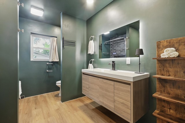 4816 Reynolds Rd, North Richland Hills, TX 76180 - full bath with wood finished floors, toilet, and vanity