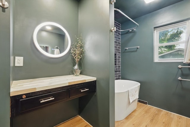 4816 Reynolds Rd, North Richland Hills, TX 76180 - full bath with a freestanding bath, wood finished floors, a shower, and vanity