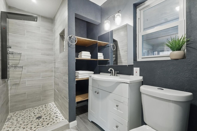 4816 Reynolds Rd, North Richland Hills, TX 76180 - bathroom with tiled shower, vanity, and toilet
